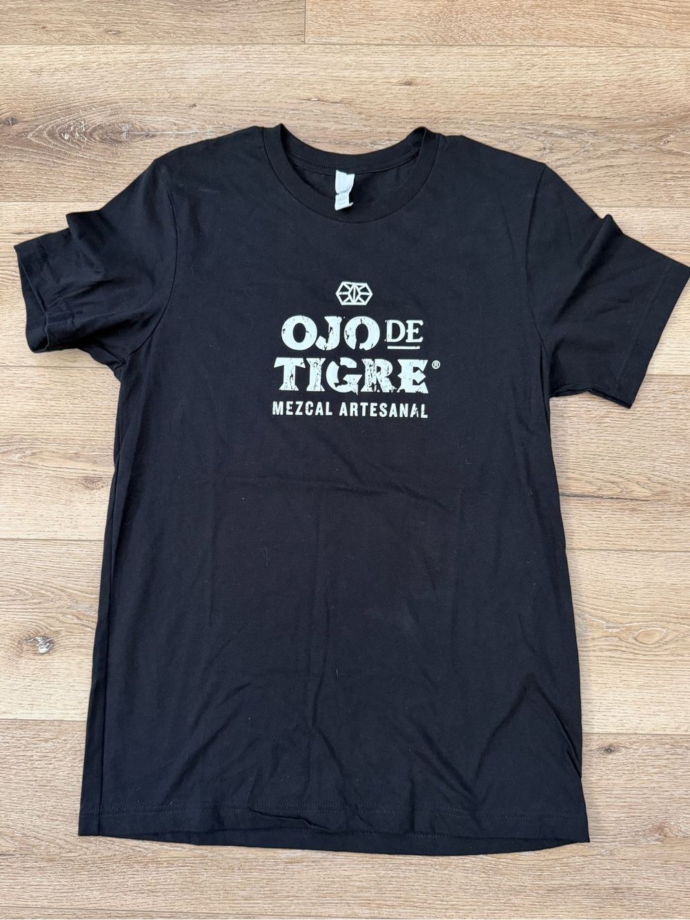 Bella Canvas Black Short Sleeve Tee with White 'Ojo de Tigre' Mezcal Logo